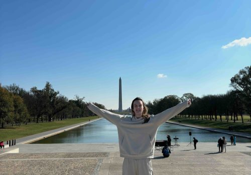 Amanda posing in front of the reflecting pool in Washington DC