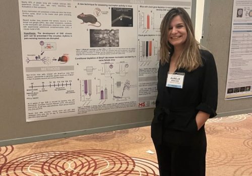 Aurelie standing in front of her endMS poster