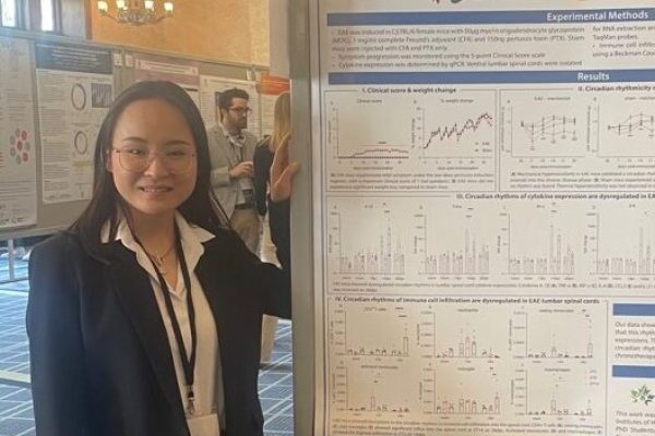 Vina in front of her research poster