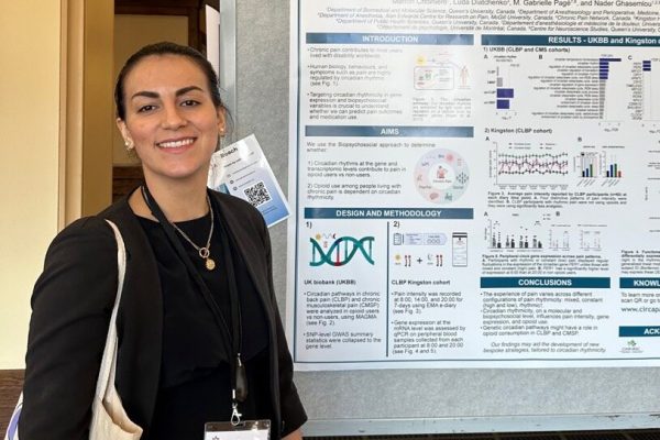 Doriana in front of her research poster